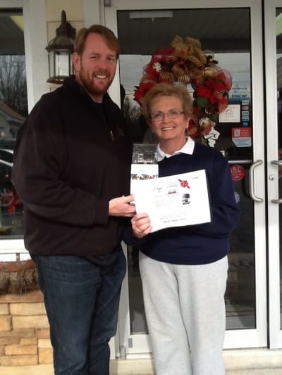 GoPro Winner, Mary Jane Beilke, pictured with Metro Garage Owner - Derrick Thompson